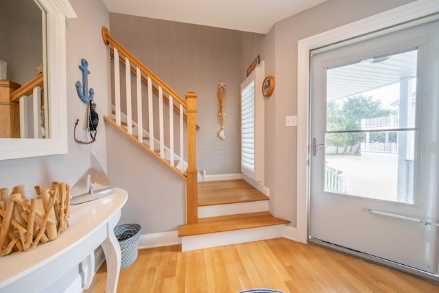 254 89th St Unit 1, Stone Harbor, NJ 08247 - entryway with wood finished floors, stairs, and baseboards