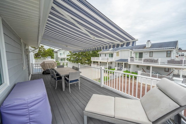 254 89th St Unit 1, Stone Harbor, NJ 08247 - wooden deck with outdoor dining area and a residential view