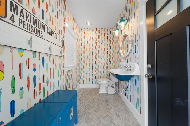 bathroom featuring sink and toilet