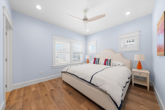 bedroom with ceiling fan and wood-type flooring