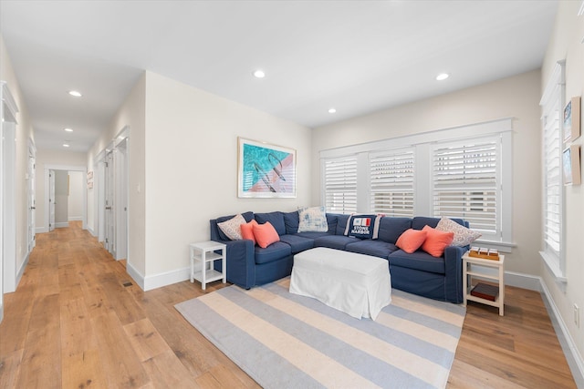 living room with light hardwood / wood-style floors