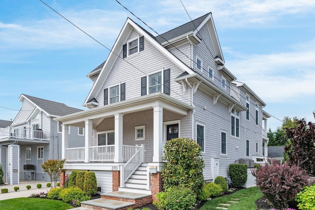 view of front of property featuring a porch and central AC unit