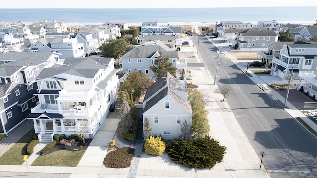 birds eye view of property featuring a residential view and a water view