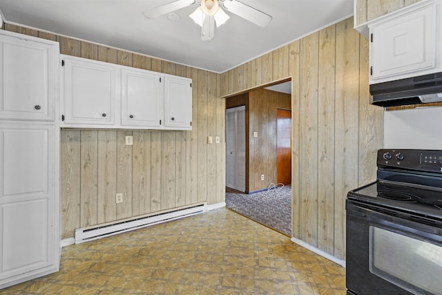112 Oakdale Ave, Villas, NJ 08251 - kitchen with wooden walls, black electric range, tile patterned floors, a baseboard heating unit, and white cabinetry