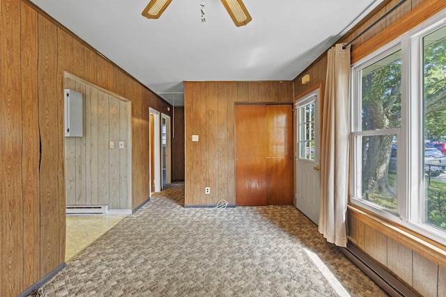 112 Oakdale Ave, Villas, NJ 08251 - spare room featuring plenty of natural light, wooden walls, ceiling fan, and a baseboard radiator