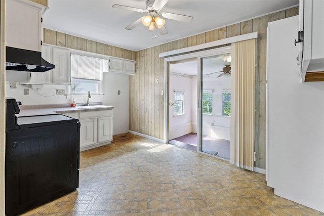 112 Oakdale Ave, Villas, NJ 08251 - kitchen featuring a ceiling fan, black electric range, exhaust hood, white cabinets, and plenty of natural light