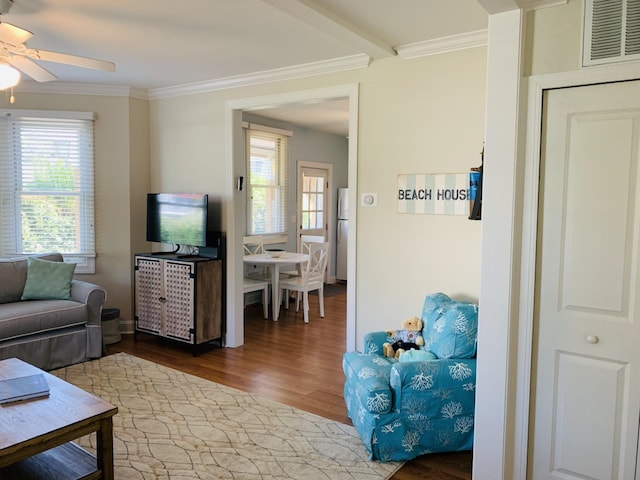 living room featuring crown molding, hardwood / wood-style flooring, and ceiling fan