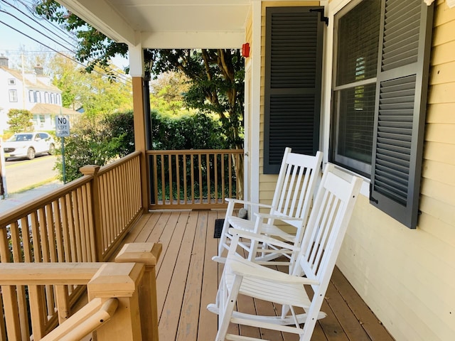 wooden terrace with a porch