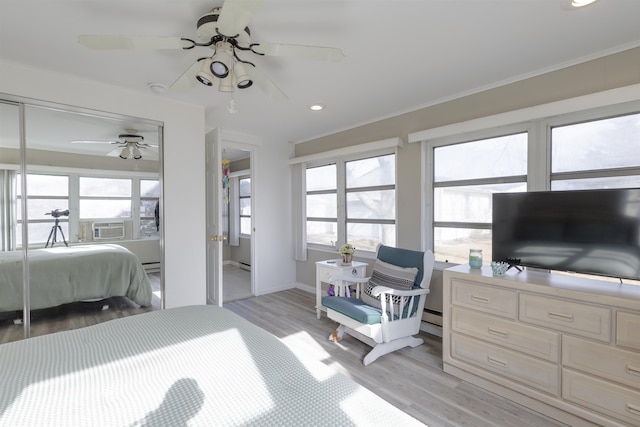 bedroom with baseboard heating, ceiling fan, light hardwood / wood-style floors, and ornamental molding