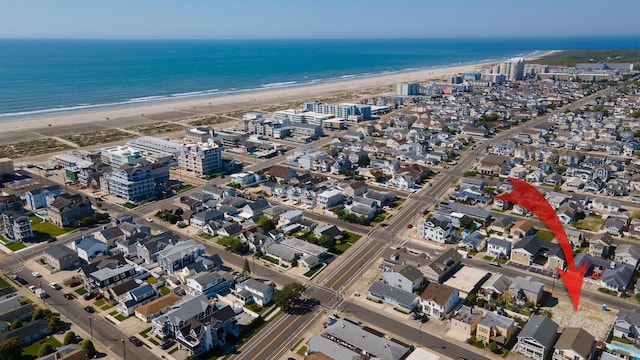 aerial view with a beach view and a water view