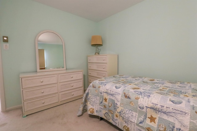 bedroom featuring light colored carpet