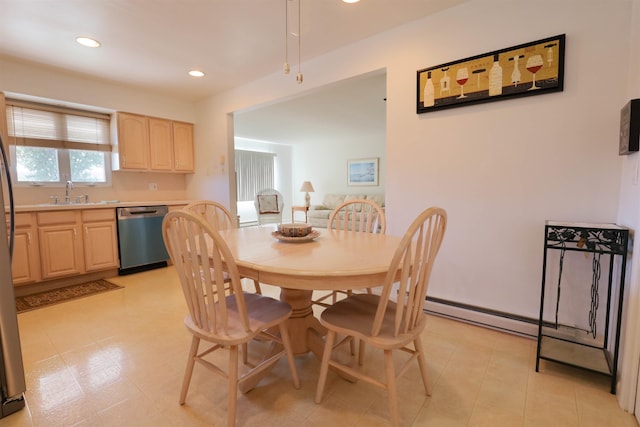 dining area with baseboard heating and sink