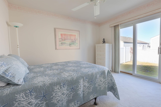 carpeted bedroom featuring access to outside and ceiling fan