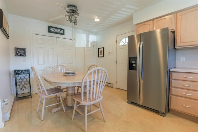 dining space featuring ceiling fan