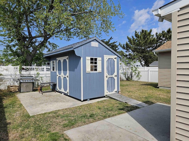 view of shed with a fenced backyard