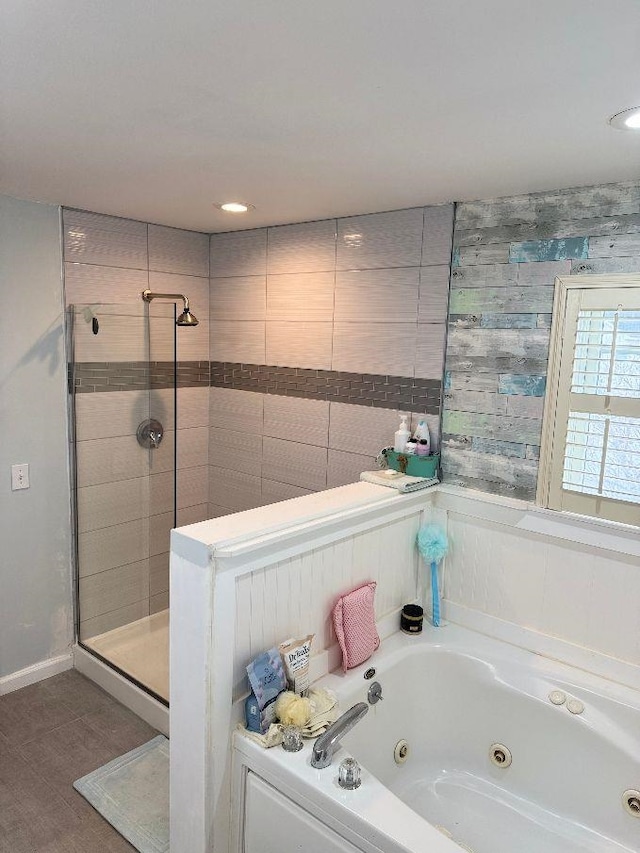 bathroom with shower with separate bathtub