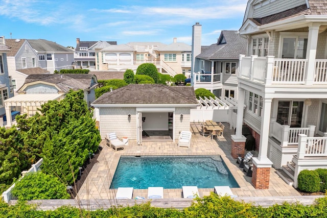 1 108th St, Stone Harbor, NJ 08247 - swimming pool featuring a residential view, an outbuilding, a patio, a storage structure, and a pergola