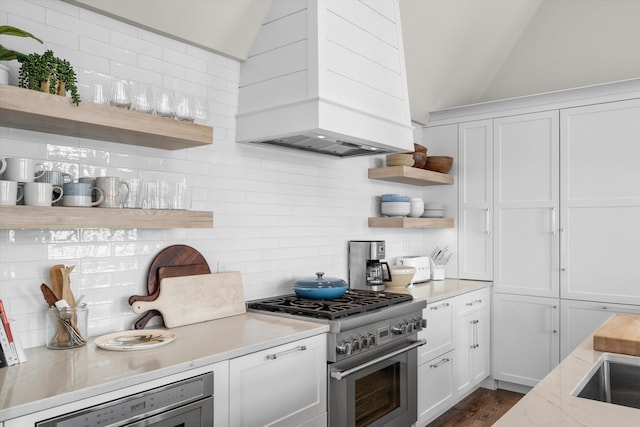 1 108th St, Stone Harbor, NJ 08247 - kitchen featuring open shelves, premium range hood, stainless steel range, backsplash, and lofted ceiling