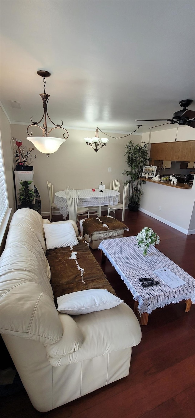 dining space featuring ceiling fan and dark wood-type flooring