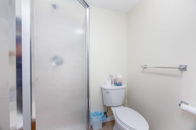 bathroom with toilet and walk in shower