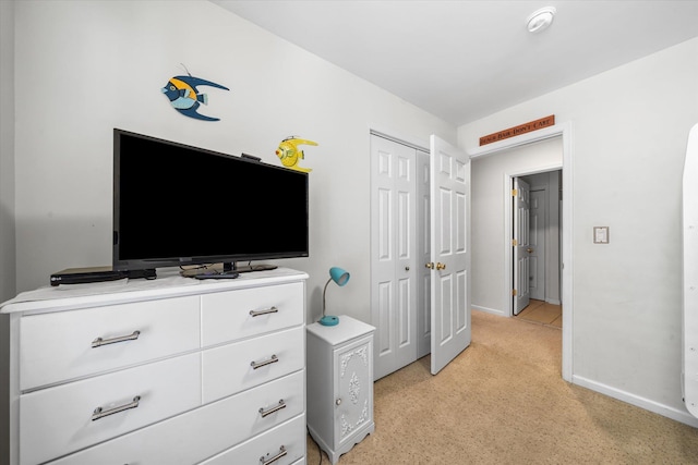 bedroom featuring a closet and baseboards