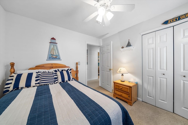 bedroom with a closet, baseboards, and ceiling fan