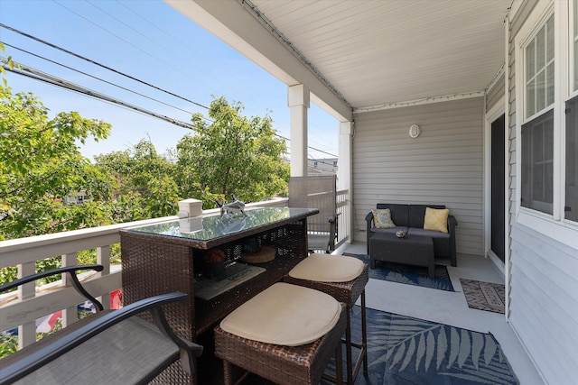 balcony featuring an outdoor living space