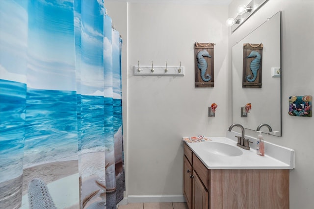 full bath featuring tile patterned flooring, baseboards, vanity, and a shower with curtain