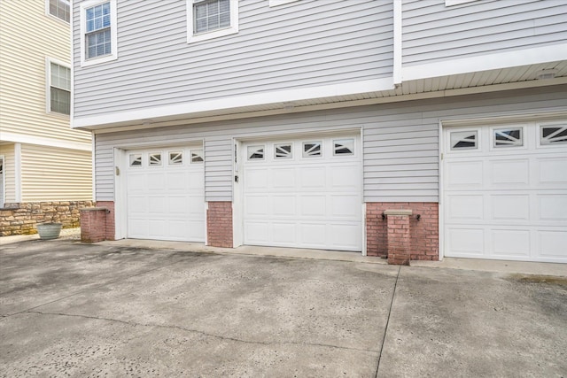 garage with concrete driveway