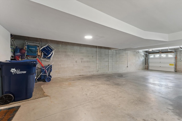 garage featuring concrete block wall