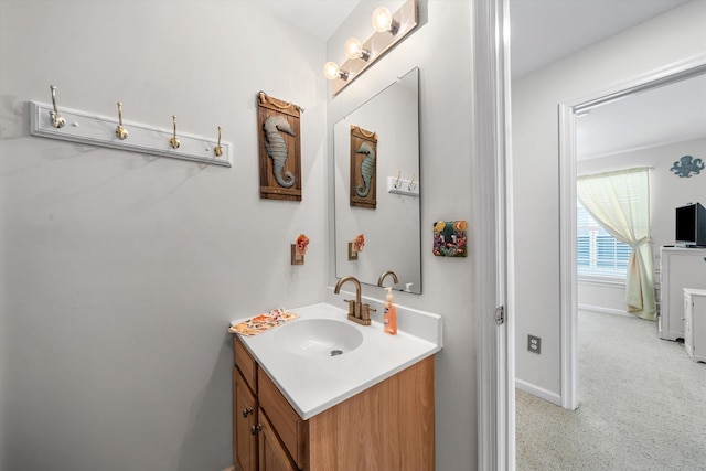 bathroom featuring vanity and baseboards