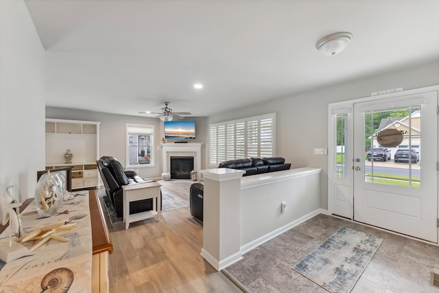 19 Canterbury Way, Cape May Court House, NJ 08210 - living room featuring plenty of natural light, a glass covered fireplace, a ceiling fan, and baseboards