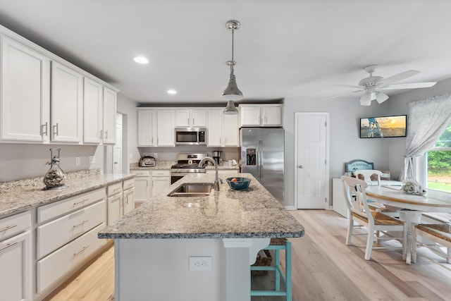 19 Canterbury Way, Cape May Court House, NJ 08210 - kitchen featuring appliances with stainless steel finishes, a sink, white cabinets, ceiling fan, and light wood-style floors