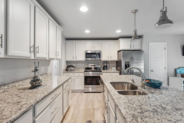 19 Canterbury Way, Cape May Court House, NJ 08210 - kitchen with appliances with stainless steel finishes, a sink, white cabinetry, recessed lighting, and light wood-style flooring