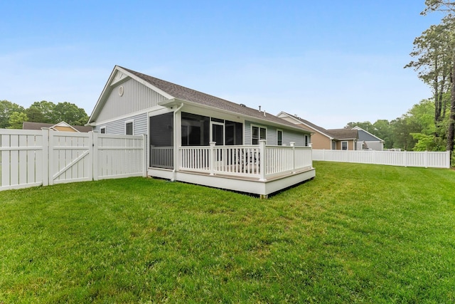 19 Canterbury Way, Cape May Court House, NJ 08210 - back of property featuring a gate, a wooden deck, a sunroom, board and batten siding, and a shingled roof