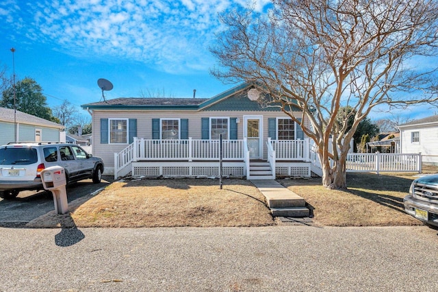 view of front of property with a porch and a front yard