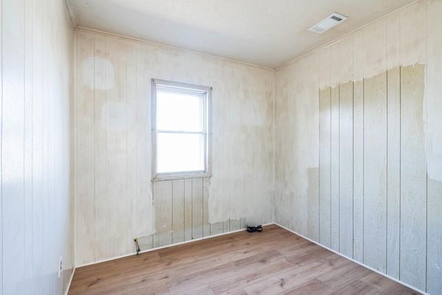 spare room with light hardwood / wood-style flooring