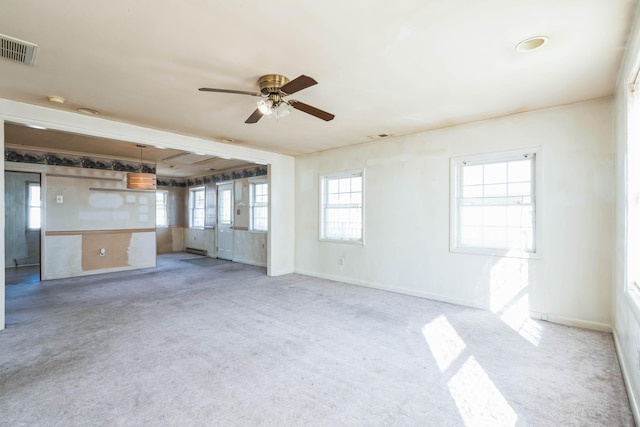 unfurnished living room featuring ceiling fan