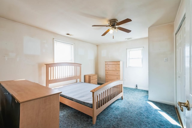 carpeted bedroom with ceiling fan