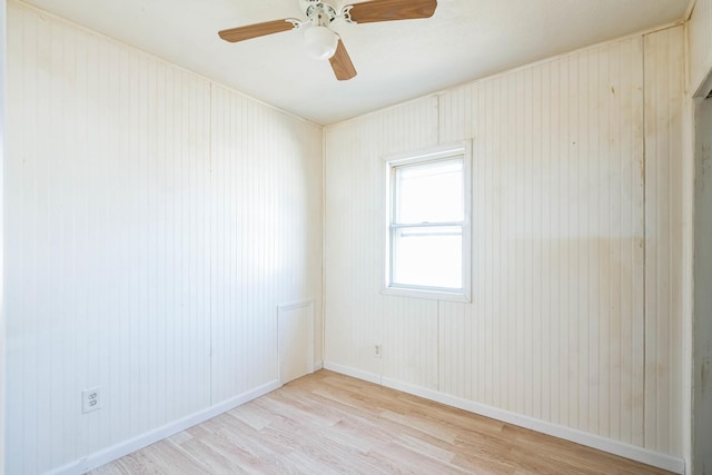 spare room with light hardwood / wood-style floors and ceiling fan