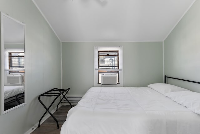 bedroom with multiple windows, cooling unit, crown molding, and wood-type flooring