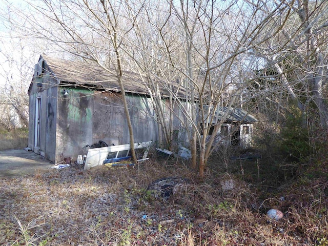 view of property exterior featuring an outdoor structure