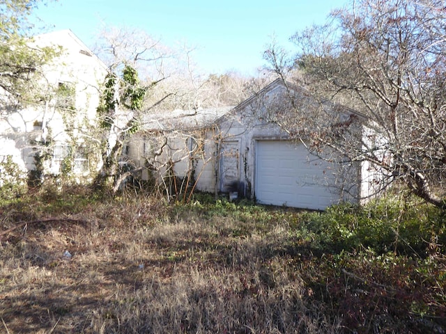 view of side of property with a garage