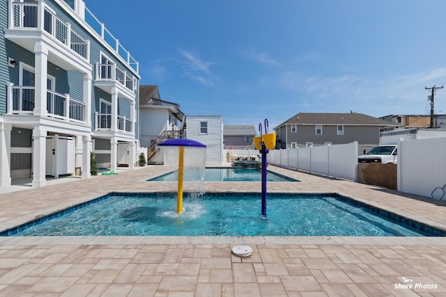 view of swimming pool featuring pool water feature