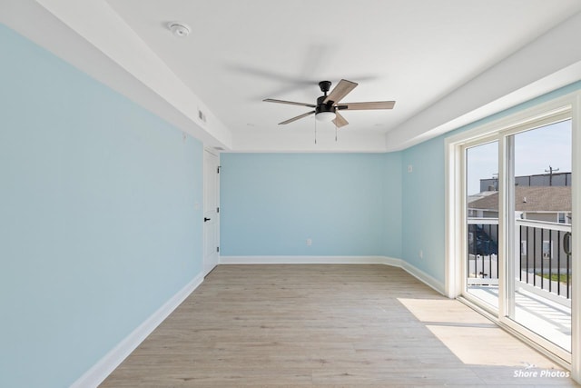 spare room featuring ceiling fan and light wood-type flooring