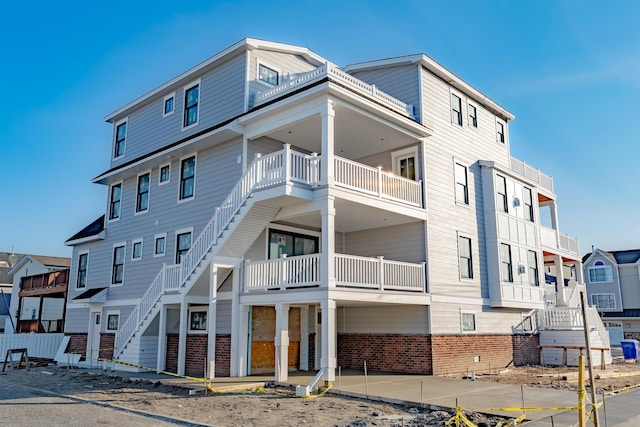 view of property featuring a residential view and stairs