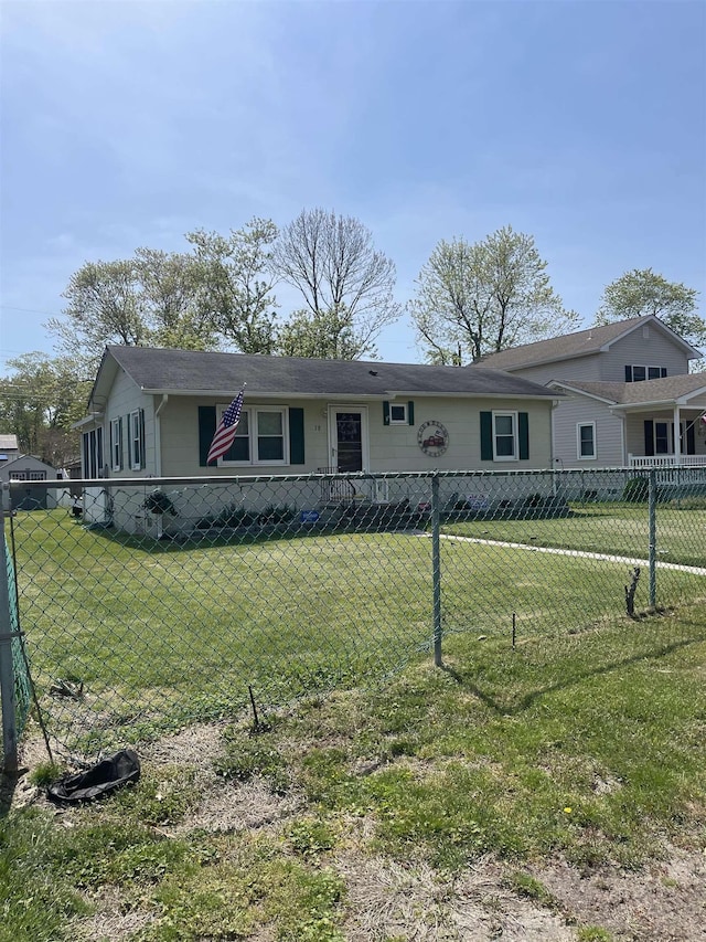 ranch-style home with a front lawn