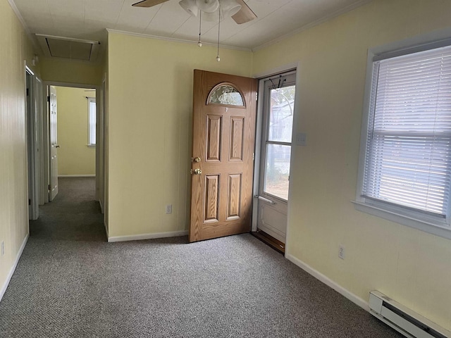 carpeted foyer featuring baseboard heating, ceiling fan, and plenty of natural light