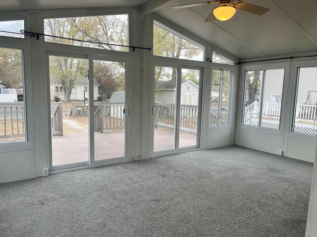 unfurnished sunroom with ceiling fan and lofted ceiling