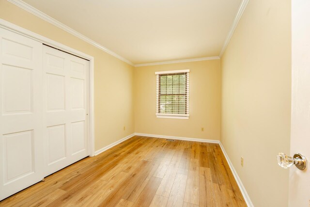 5 Edwards Ter, Seaville, NJ 08230 - unfurnished bedroom featuring light wood-type flooring, baseboards, crown molding, and a closet